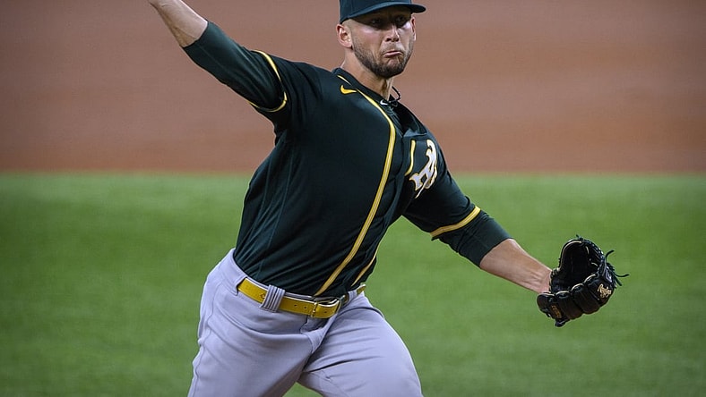 Jun 23, 2021; Arlington, Texas, USA; Oakland Athletics starting pitcher James Kaprielian (32) pitches against the Texas Rangers during the first inning at Globe Life Field. Mandatory Credit: Jerome Miron-USA TODAY Sports