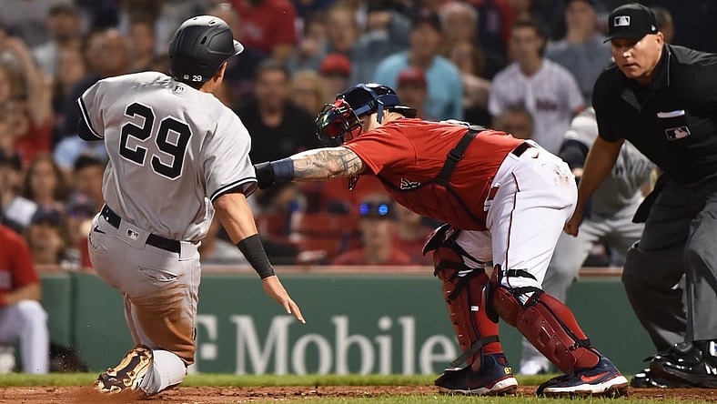 Jun 25, 2021; Boston, Massachusetts, USA;  Boston Red Sox catcher Christian Vazquez (7) tags ut New York Yankees third baseman Gio Urshela (29) during the fourth inning at Fenway Park. Mandatory Credit: Bob DeChiara-USA TODAY Sports