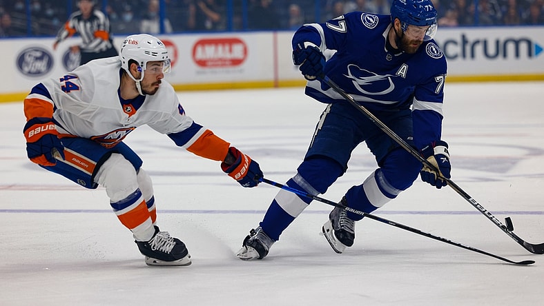 Jun 25, 2021; Tampa, Florida, USA; Tampa Bay Lightning defenseman Victor Hedman (77) handles the puck past New York Islanders center Jean-Gabriel Pageau (44) during the first period in game seven of the Stanley Cup Semifinals at Amalie Arena. Mandatory Credit: Nathan Ray Seebeck-USA TODAY Sports
