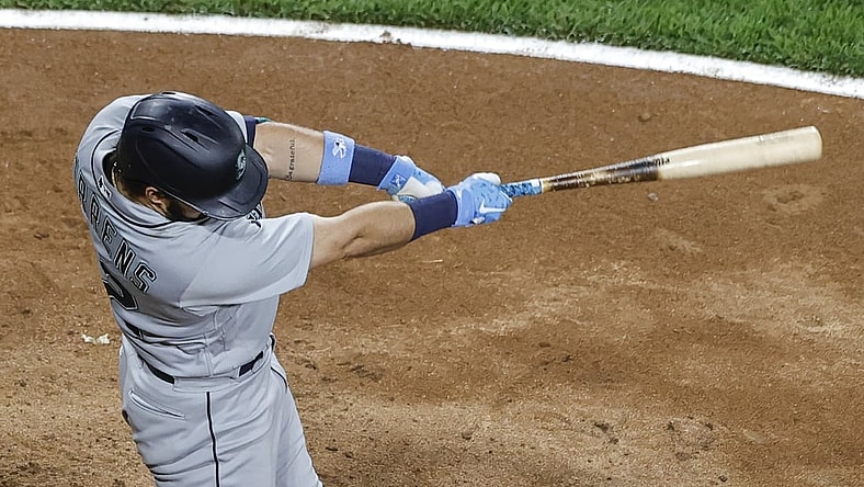 Jun 25, 2021; Chicago, Illinois, USA; Seattle Mariners catcher Luis Torrens (22) hits a two-run home run against the Chicago White Sox during the seventh inning at Guaranteed Rate Field. Mandatory Credit: Kamil Krzaczynski-USA TODAY Sports