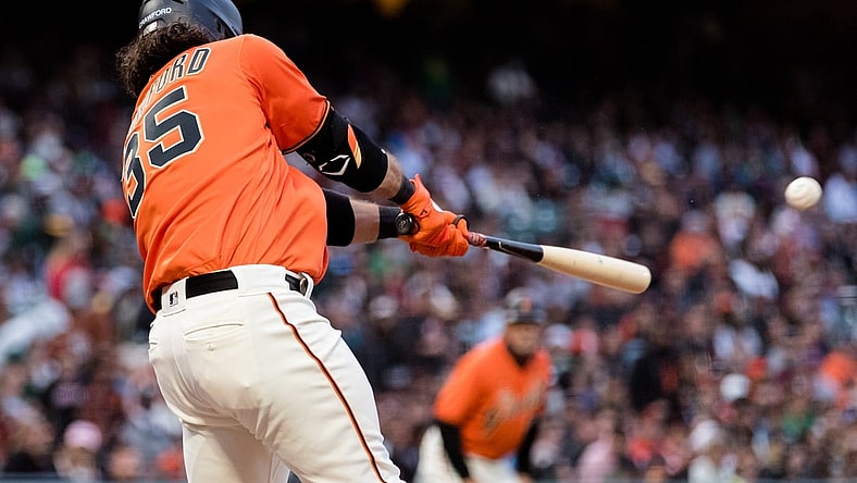 Jun 25, 2021; San Francisco, California, USA; San Francisco Giants shortstop Brandon Crawford (35) hits an RBI single against the Oakland Athletics in the fourth inning at Oracle Park. Mandatory Credit: John Hefti-USA TODAY Sports
