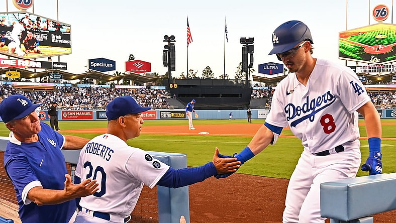 Jun 25, 2021; Los Angeles, California, USA;  Los Angeles Dodgers second baseman Zach McKinstry (8) is congratulated in the dugout by bench coach Bob Geren (88) and manager Dave Roberts (30) after hitting a solo home run in the third inning of the game against the Chicago Cubs at Dodger Stadium. Mandatory Credit: Jayne Kamin-Oncea-USA TODAY Sports