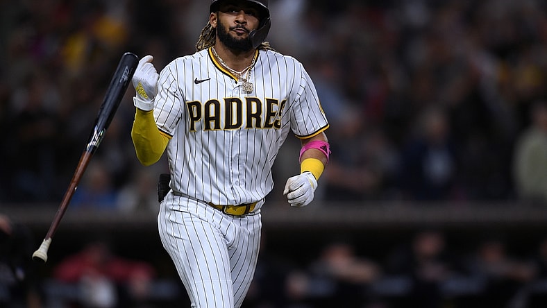Jun 25, 2021; San Diego, California, USA; San Diego Padres shortstop Fernando Tatis Jr. (23) flips his bat after hitting a two-run home run against the Arizona Diamondbacks during the fourth inning at Petco Park. Mandatory Credit: Orlando Ramirez-USA TODAY Sports