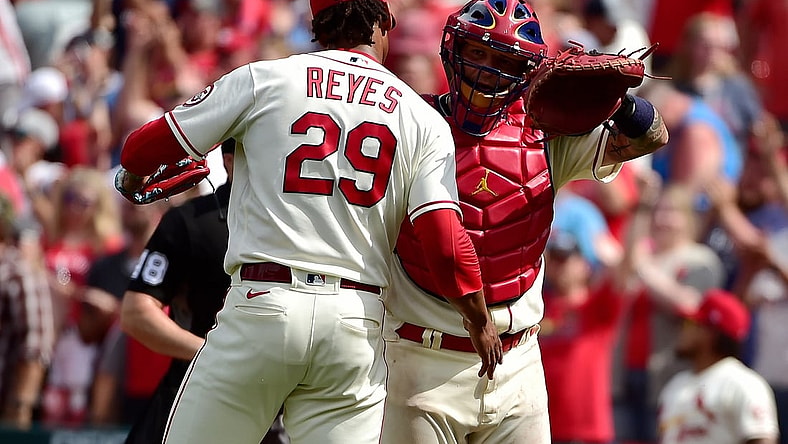 Jun 26, 2021; St. Louis, Missouri, USA;  St. Louis Cardinals catcher Yadier Molina (4) celebrates with relief pitcher Alex Reyes (29) after the Cardinals defeated the Pittsburgh Pirates at Busch Stadium. Mandatory Credit: Jeff Curry-USA TODAY Sports