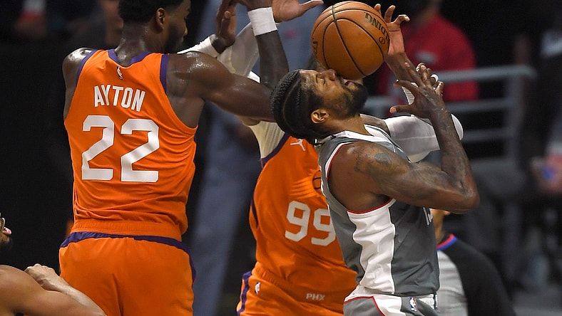 Jun 26, 2021; Los Angeles, California, USA; Los Angeles Clippers guard Paul George (13) drives to the basket against Phoenix Suns center Deandre Ayton (22) and forward Jae Crowder (99) in the first half of game four of the Western Conference Finals for the 2021 NBA Playoffs at Staples Center. Mandatory Credit: Jayne Kamin-Oncea-USA TODAY Sports