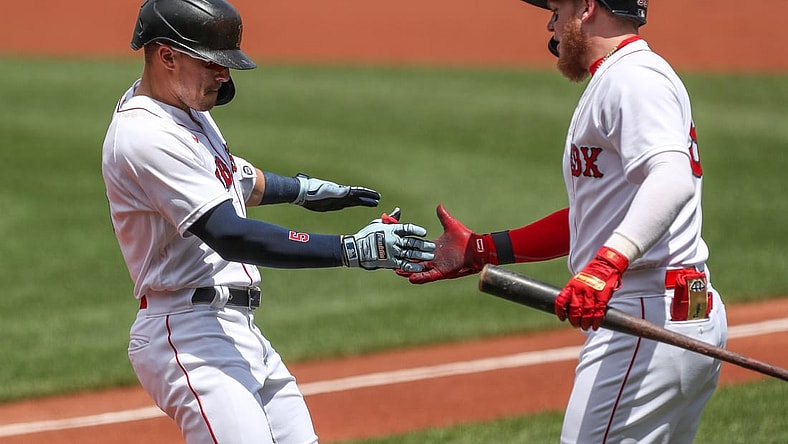 Jun 27, 2021; Boston, Massachusetts, USA; Boston Red Sox center fielder Enrique Hernandez (5) celebrates with Boston Red Sox left fielder Alex Verdugo (99) after hitting a home run during the first inning against the New York Yankees at Fenway Park. Mandatory Credit: Paul Rutherford-USA TODAY Sports