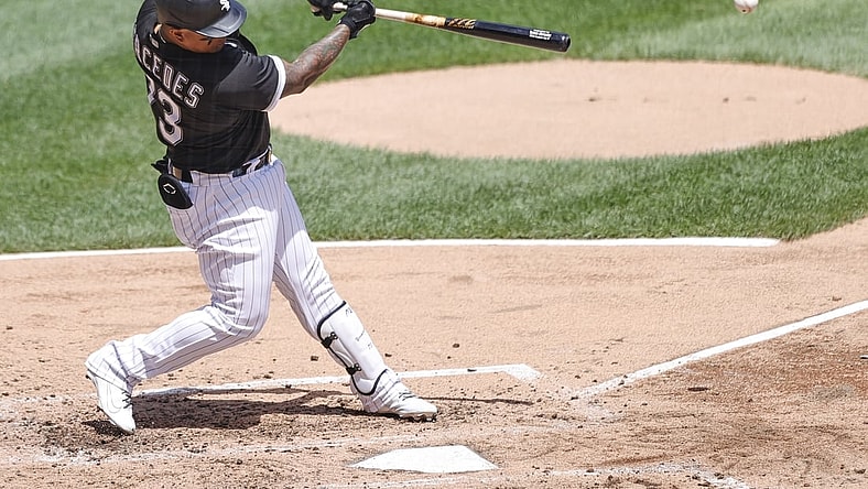 Jun 27, 2021; Chicago, Illinois, USA; Chicago White Sox catcher Yermin Mercedes (73) singles against the Seattle Mariners during the fifth inning of the first game of a doubleheader at Guaranteed Rate Field. Mandatory Credit: Kamil Krzaczynski-USA TODAY Sports