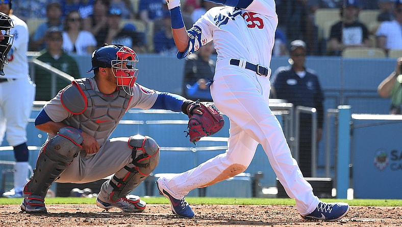 Jun 27, 2021; Los Angeles, California, USA;   Los Angeles Dodgers center fielder Cody Bellinger (35) hits a two run home run off of Chicago Cubs starting pitcher Adbert Alzolay (73) in the second inning of the game at Dodger Stadium. Mandatory Credit: Jayne Kamin-Oncea-USA TODAY Sports