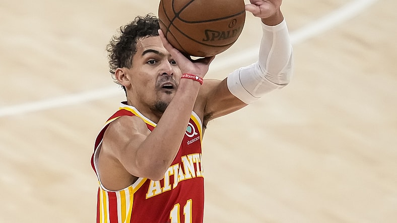 Jun 27, 2021; Atlanta, Georgia, USA; Atlanta Hawks guard Trae Young (11) shoots a three point shot against the Milwaukee Bucks during the first quarter during game three of the Eastern Conference Finals for the 2021 NBA Playoffs at State Farm Arena. Mandatory Credit: Dale Zanine-USA TODAY Sports