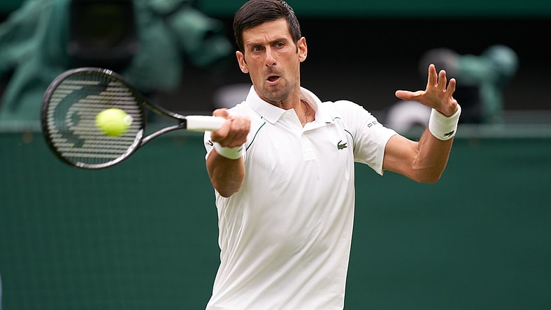 Jun 28, 2021; London, United Kingdom;  Novak Djokovic (SRB) seen playing against Jack Draper (GBR) on the centre court in the first round at All England Lawn Tennis and Croquet Club. Mandatory Credit: Peter van den Berg-USA TODAY Sports