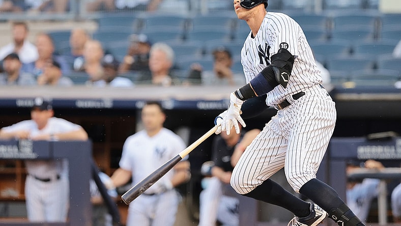 Jun 28, 2021; Bronx, New York, USA; New York Yankees right fielder Aaron Judge (99) hits an RBI double during the first inning against the Los Angeles Angels at Yankee Stadium. Mandatory Credit: Vincent Carchietta-USA TODAY Sports