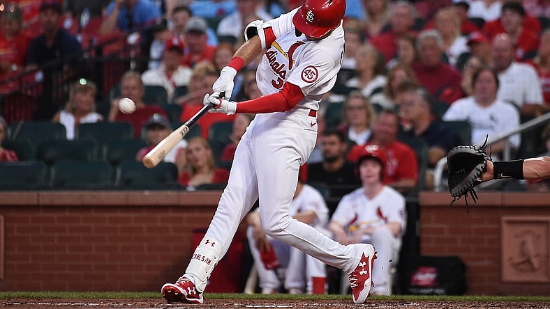 Jun 28, 2021; St. Louis, Missouri, USA; St. Louis Cardinals center fielder Dylan Carlson (3) hits an RBI triple against the Arizona Diamondbacks in the third inning at Busch Stadium. Mandatory Credit: Joe Puetz-USA TODAY Sports