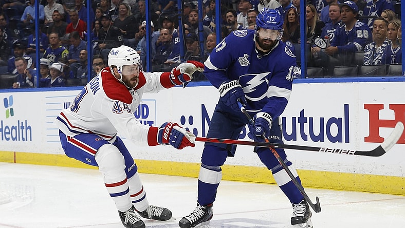 Jun 28, 2021; Tampa, Florida, USA; Tampa Bay Lightning left wing Alex Killorn (17) passes the puck away from Montreal Canadiens defenseman Joel Edmundson (44) in the second period of game one of the 2021 Stanley Cup Final at Amalie Arena. Mandatory Credit: Kim Klement-USA TODAY Sports