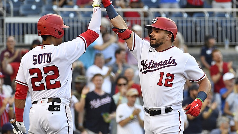 Jun 29, 2021; Washington, District of Columbia, USA; Washington Nationals left fielder Kyle Schwarber (12) is congratulated by left fielder Juan Soto (22) after hitting a solo home run during the first inning at Nationals Park. Mandatory Credit: Brad Mills-USA TODAY Sports