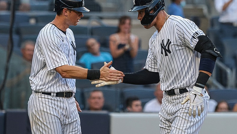Jun 29, 2021; Bronx, New York, USA;  New York Yankees right fielder Aaron Judge (99) celebrates his two run home run with second baseman DJ LeMahieu (26) during the second inning against the Los Angeles Angels at Yankee Stadium. Mandatory Credit: Vincent Carchietta-USA TODAY Sports