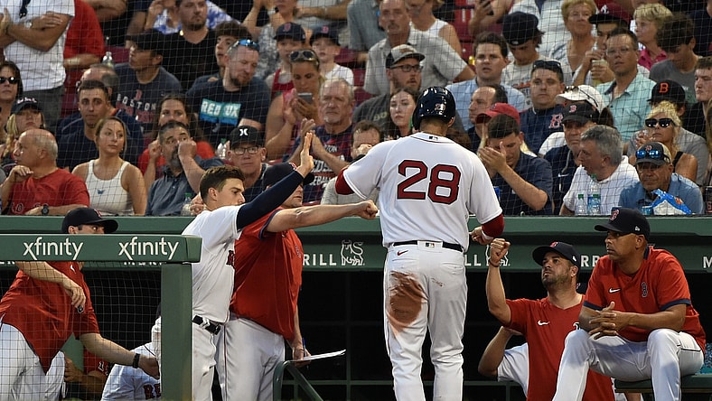 Jun 29, 2021; Boston, Massachusetts, USA; Boston Red Sox designated hitter J.D. Martinez (28) is greeted in the dugout after scoring a run during the third inning against the Kansas City Royals at Fenway Park. Mandatory Credit: Bob DeChiara-USA TODAY Sports