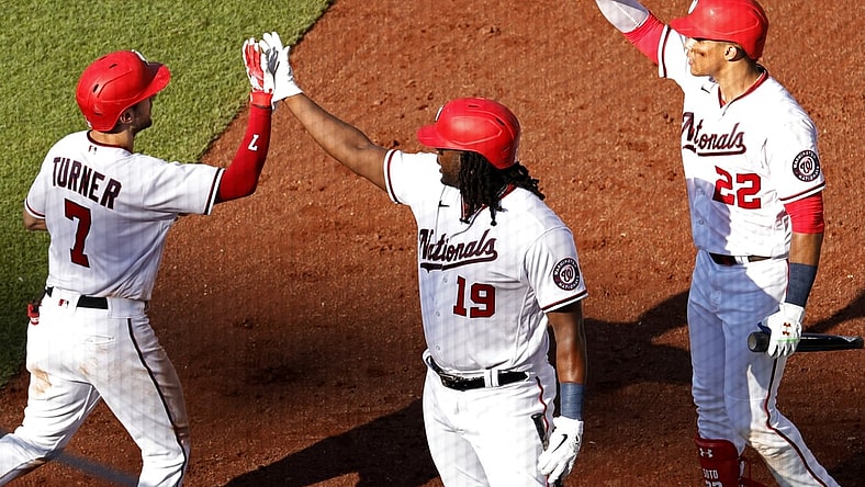 Jun 30, 2021; Washington, District of Columbia, USA; Washington Nationals shortstop Trea Turner (7) celebrates with Nationals first baseman Josh Bell (19) and Nationals left fielder Juan Soto (22) after hitting a home run against the Tampa Bay Rays in the fourth inning at Nationals Park. Mandatory Credit: Geoff Burke-USA TODAY Sports