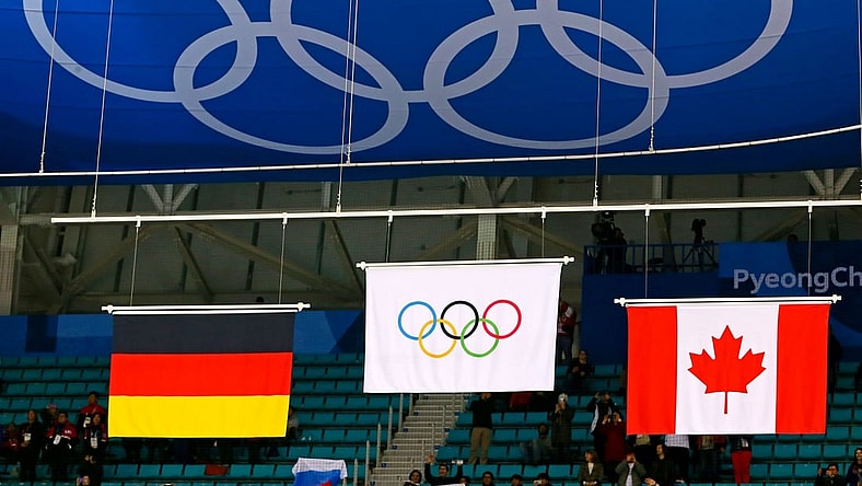Feb 24, 2018; Gangneung, South Korea; The Olympic flag is raised for the Olympic Athletes from Russia after beating Germany in the men's ice hockey gold medal match during the Pyeongchang 2018 Olympic Winter Games at Gangneung Hockey Centre. Mandatory Credit: David E. Klutho-USA TODAY Sports