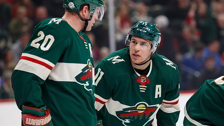 Feb 27, 2018; Saint Paul, MN, USA; Minnesota Wild forward Zach Parise (11) talks to defenseman Ryan Suter (20) in the first period against the St Louis Blues at Xcel Energy Center. Mandatory Credit: Brad Rempel-USA TODAY Sports
