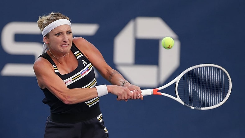 Aug 26, 2019; Flushing, NY, USA; Timea Bacsinszky of Switzerland returns a shot against Catherine McNally of the United States in a first round match on day one of the 2019 U.S. Open tennis tournament at USTA Billie Jean King National Tennis Center. Mandatory Credit: Jerry Lai-USA TODAY Sports