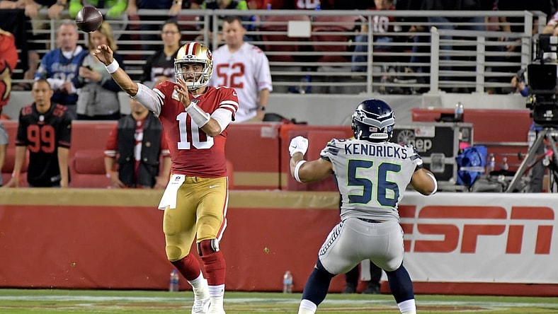 Nov 11, 2019; Santa Clara, CA, USA; San Francisco 49ers quarterback Jimmy Garoppolo (10) throws a pass over Seattle Seahawks linebacker Mychal Kendricks (56) during the first half at Levi's Stadium. Mandatory Credit: Kirby Lee-USA TODAY Sports