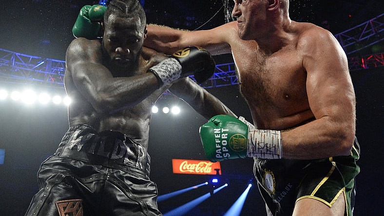 Feb 22, 2020; Las Vegas, Nevada, USA; Deontay Wilder and Tyson Fury box during their WBC heavyweight title bout at MGM Grand Garden Arena. Fury won via seventh round TKO. Mandatory Credit: Joe Camporeale-USA TODAY Sports