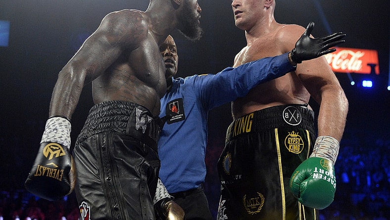 Feb 22, 2020; Las Vegas, Nevada, USA; Deontay Wilder and Tyson Fury stare at one another during their WBC heavyweight title bout at MGM Grand Garden Arena. Fury won via seventh round TKO. Mandatory Credit: Joe Camporeale-USA TODAY Sports