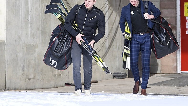 Mar 15, 2020; Calgary, AB, Canada; Calgary Hitmen forward Josh Prokop (10) and defensemen Luke Prokop (6) depart from the Scotiabank Saddledome. The Western Hockey League (WHL) season has been paused due to the COVID-19 coronavirus outbreak.  Mandatory Credit: Candice Ward-USA TODAY Sports