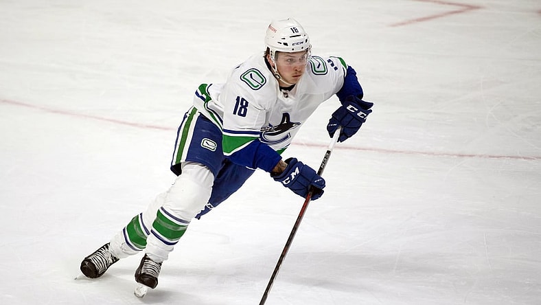 Mar 15, 2021; Ottawa, Ontario, CAN; Vancouver Canucks right wing Jake Virtanen (18) skates with the puck in the third period against the Ottawa Senators at the Canadian Tire Centre. Mandatory Credit: Marc DesRosiers-USA TODAY Sports