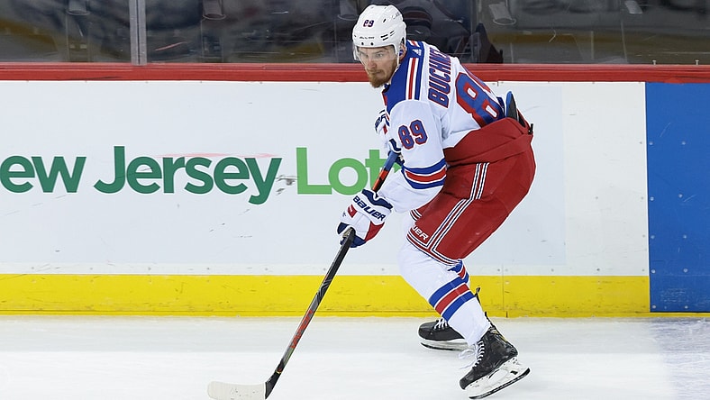 Apr 18, 2021; Newark, New Jersey, USA; New York Rangers right wing Pavel Buchnevich (89) skates with the puck against the New Jersey Devils during the second period at Prudential Center. Mandatory Credit: Vincent Carchietta-USA TODAY Sports