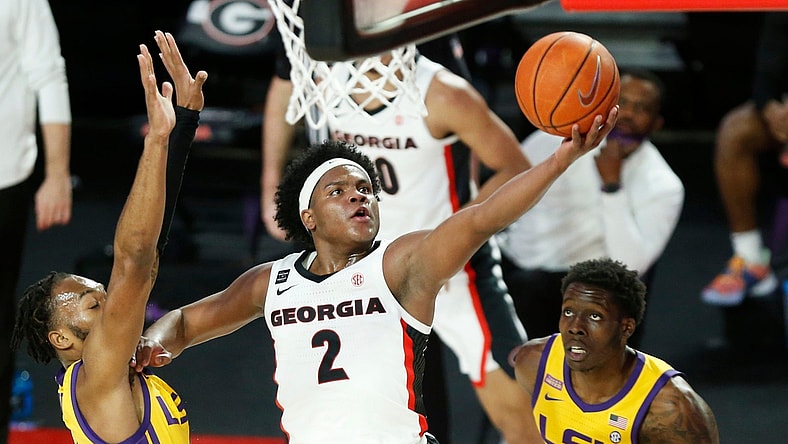Georgia's Sahvir Wheeler (2) takes a shot while being defended by LSU guard Javonte Smart (1) and LSU forward Josh LeBlanc Sr. (11) during an NCAA basketball game between Georgia and LSU in Athens, Ga., on Tuesday, Feb 23, 2021. (Photo/Joshua L. Jones, Athens Banner-Herald)
News Joshua L Jones