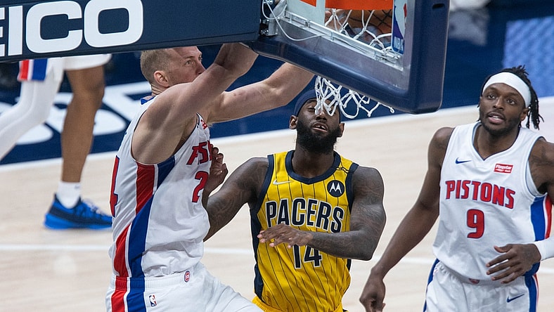 Apr 24, 2021; Indianapolis, Indiana, USA; Detroit Pistons center Mason Plumlee (24) dunks against Indiana Pacers forward JaKarr Sampson (14) in the third quarter at Bankers Life Fieldhouse. Mandatory Credit: Trevor Ruszkowski-USA TODAY Sports