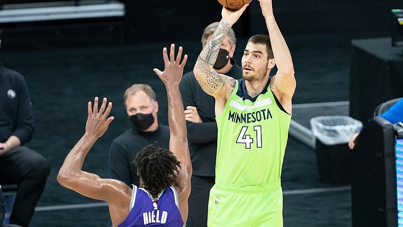 April 20, 2021; Sacramento, California, USA; Minnesota Timberwolves forward Juancho Hernangomez (41) shoots the basketball against Sacramento Kings guard Buddy Hield (24) during the first quarter at Golden 1 Center. Mandatory Credit: Kyle Terada-USA TODAY Sports