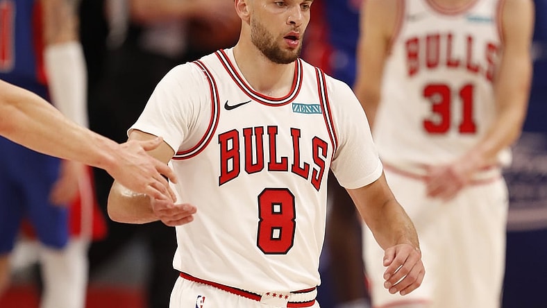 May 9, 2021; Detroit, Michigan, USA; Chicago Bulls guard Zach LaVine (8) gives five to a teammate as he walks to the bench during the second quarter against the Detroit Pistons at Little Caesars Arena. Mandatory Credit: Raj Mehta-USA TODAY Sports