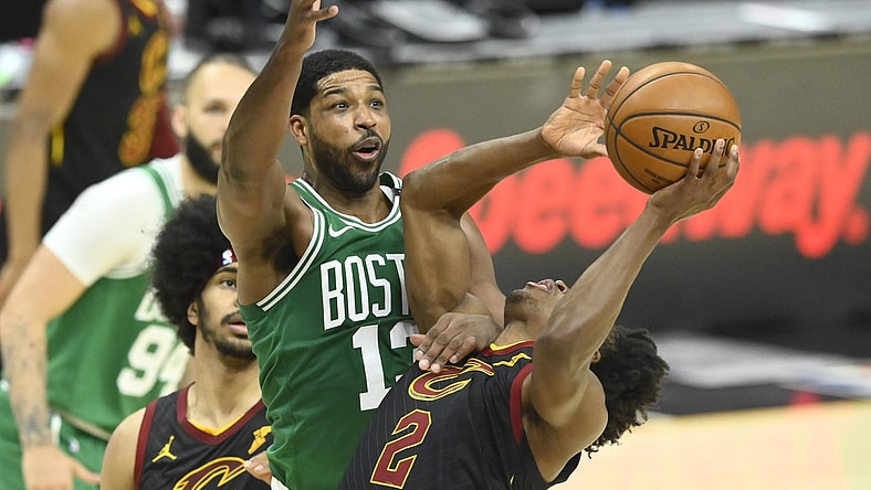 May 12, 2021; Cleveland, Ohio, USA; Boston Celtics center Tristan Thompson (13) defends Cleveland Cavaliers guard Collin Sexton (2) in the third quarter at Rocket Mortgage FieldHouse. Mandatory Credit: David Richard-USA TODAY Sports