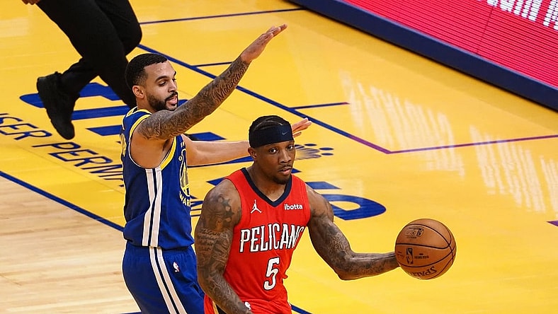 May 14, 2021; San Francisco, California, USA; New Orleans Pelicans guard Eric Bledsoe (5) looks to pass the ball against Golden State Warriors guard Mychal Mulder (15) during the second quarter at Chase Center. Mandatory Credit: Kelley L Cox-USA TODAY Sports