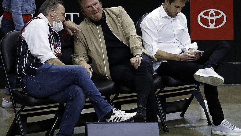 May 14, 2021; Houston, Texas, USA; Houston Rockets owner Tilman Fertitta (center) and team president Tad Brown (left) and Patrick Fertitta (right) sit court-side as the Houston Rockets play the LA Clippers at Toyota Center. Mandatory Credit:  Bob Levey/Pool Photo-USA TODAY Sports