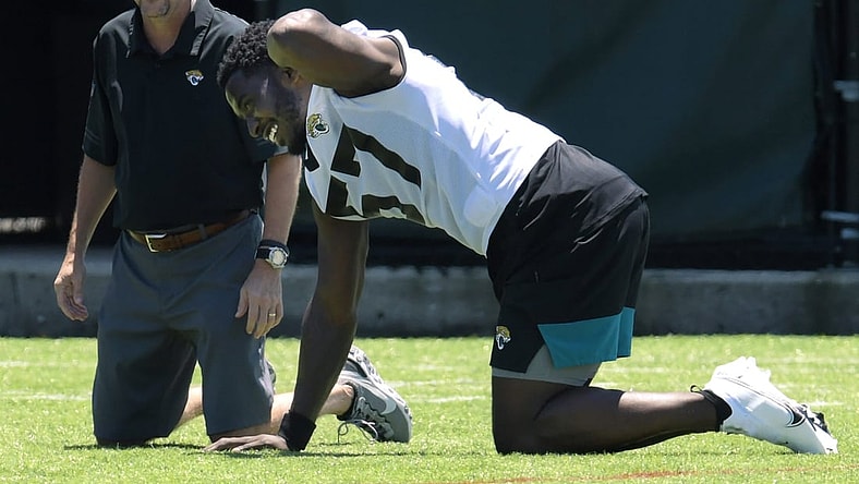 Jaguars line backer #57, Dylan Moses goes through stretching drills during Saturday's Rookie Minicamp session. The Jacksonville Jaguars held their Saturday 2021 Rookie Minicamp session at the practice fields outside TIAA Bank Field Saturday, May 15, 2021.

Jki 051521 Jaguarsrookiecamp 22