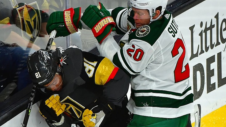 May 18, 2021; Las Vegas, Nevada, USA; Minnesota Wild defenseman Ryan Suter (20) hits Vegas Golden Knights center Jonathan Marchessault (81) during the first period of game two of the first round of the 2021 Stanley Cup Playoffs at T-Mobile Arena. Mandatory Credit: Stephen R. Sylvanie-USA TODAY Sports