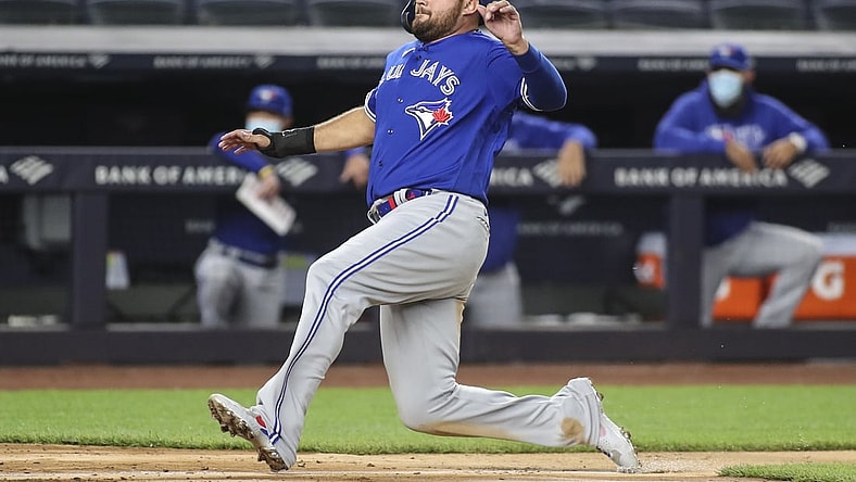May 25, 2021; Bronx, New York, USA; Toronto Blue Jays designated hitter Rowdy Tellez (44) starts sliding into home plate in the seventh inning against the New York Yankees at Yankee Stadium. Mandatory Credit: Wendell Cruz-USA TODAY Sports