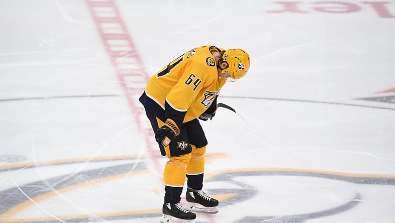 May 27, 2021; Nashville, Tennessee, USA; Nashville Predators center Mikael Granlund (64) reacts after an overtime loss against the Carolina Hurricanes in game six of the first round of the 2021 Stanley Cup Playoffs at Bridgestone Arena. Mandatory Credit: Christopher Hanewinckel-USA TODAY Sports
