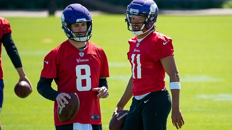 May 26, 2021; Eagan, Minnesota, USA; Minnesota Vikings quarterback Kirk Cousins (8) and quarterback Kellen Mond (11) participate in drills at OTA at TCO Performance Center. Mandatory Credit: Brad Rempel-USA TODAY Sports