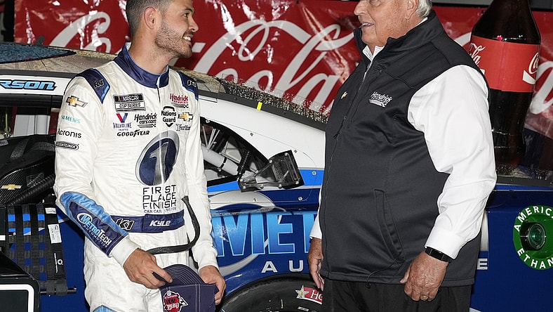 May 30, 2021; Concord, North Carolina, USA;  NASCAR Cup Series driver Kyle Larson (5) talks with team owner Rick Hendrick on his winning the Coca-Cola 600 at Charlotte Motor Speedway. Mandatory Credit: Jim Dedmon-USA TODAY Sports