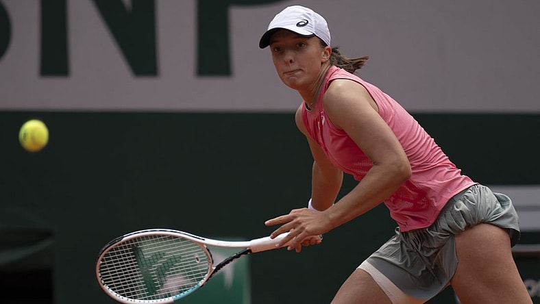 Jun 9, 2021; Paris, France; Iga Swiatek (POL) in action during her match against Maria Sakkari (GRE) on day 11 of the French Open at Stade Roland Garros. Mandatory Credit: Susan Mullane-USA TODAY Sports