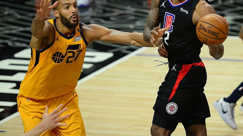 Jun 14, 2021; Los Angeles, California, USA; Los Angeles Clippers forward Kawhi Leonard (2) passes the ball against Utah Jazz center Rudy Gobert (27) during the second half in game four in the second round of the 2021 NBA Playoffs. at Staples Center. Mandatory Credit: Gary A. Vasquez-USA TODAY Sports