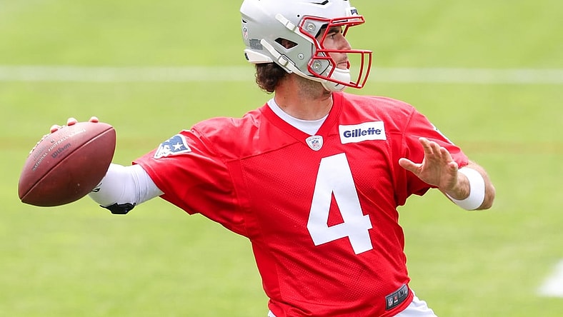 Jun 15, 2021; Foxborough, MA, USA; New England Patriots quarterback Jarrett Stidham (4) participates in a drill during the New England Patriots mini camp at the New England Patriots practice complex. Mandatory Credit: Paul Rutherford-USA TODAY Sports