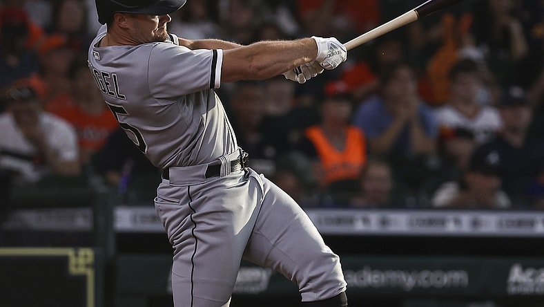 Jun 19, 2021; Houston, Texas, USA; Chicago White Sox center fielder Adam Engel (15) hits a single during the third inning against the Houston Astros at Minute Maid Park. Mandatory Credit: Troy Taormina-USA TODAY Sports