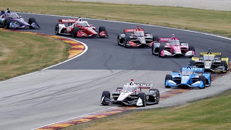 Josef Newgarden (2) leads a pack of cars through turn 1 during the NTT IndyCar Rev Group Grand Prix, Sunday, June 20, 2021, at Elkhart Lake's Road America near Plymouth, Wis.

She 062021 Rev Group Grand Prix Road America Gck 008