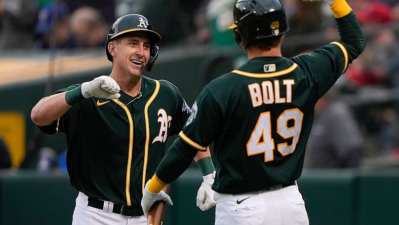 Jun 30, 2021; Oakland, California, USA;  Oakland Athletics designated hitter Frank Schwindel (45) celebrates with center fielder Skye Bolt (49) after hitting a two-run home run during the second inning against the Texas Rangers at RingCentral Coliseum. Mandatory Credit: Stan Szeto-USA TODAY Sports