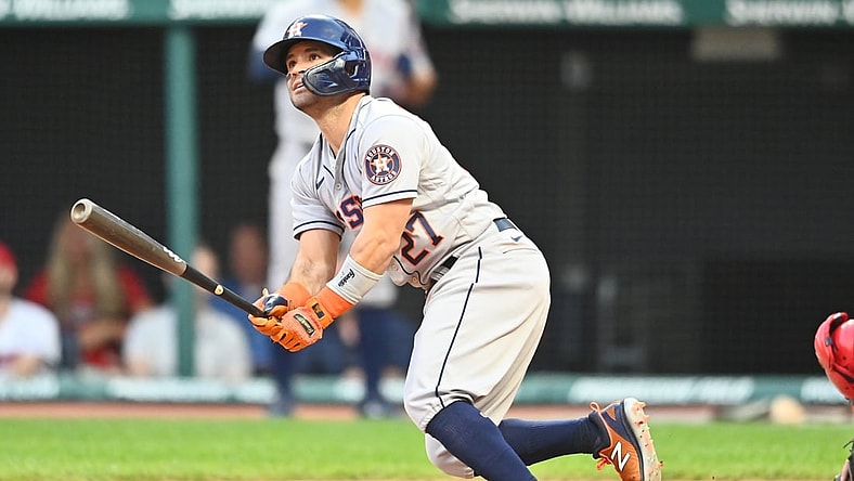 Jul 1, 2021; Cleveland, Ohio, USA; Houston Astros second baseman Jose Altuve (27) hits a grand slam during the fifth inning against the Cleveland Indians at Progressive Field. Mandatory Credit: Ken Blaze-USA TODAY Sports